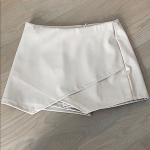 Beige skort made out of pleather (fake leather)